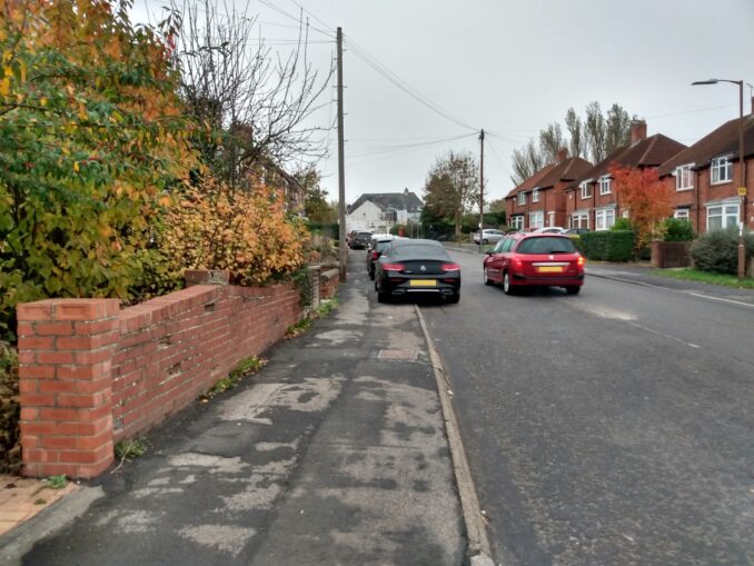 Cars parked on the pavement on Lowes Barn Bank
