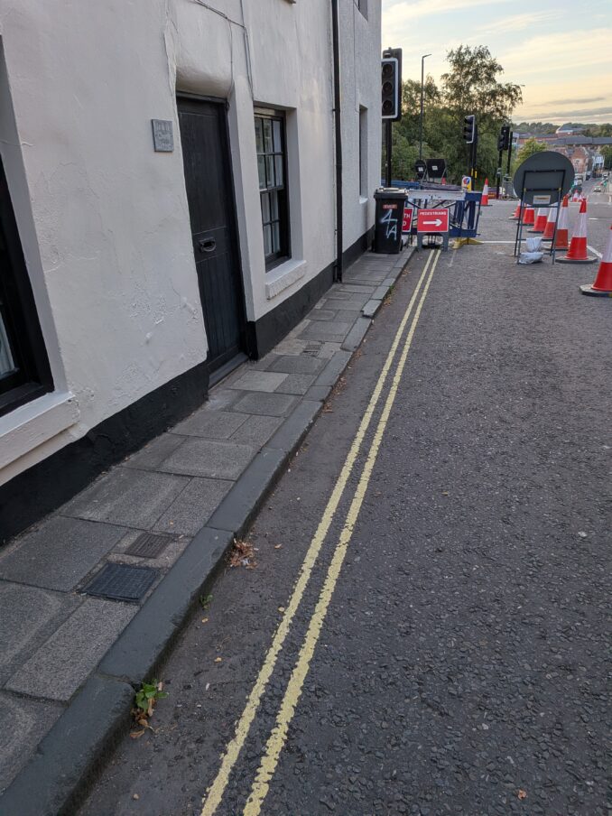 Exceptionally narrow pavement on Hallgarth Street, Durham.